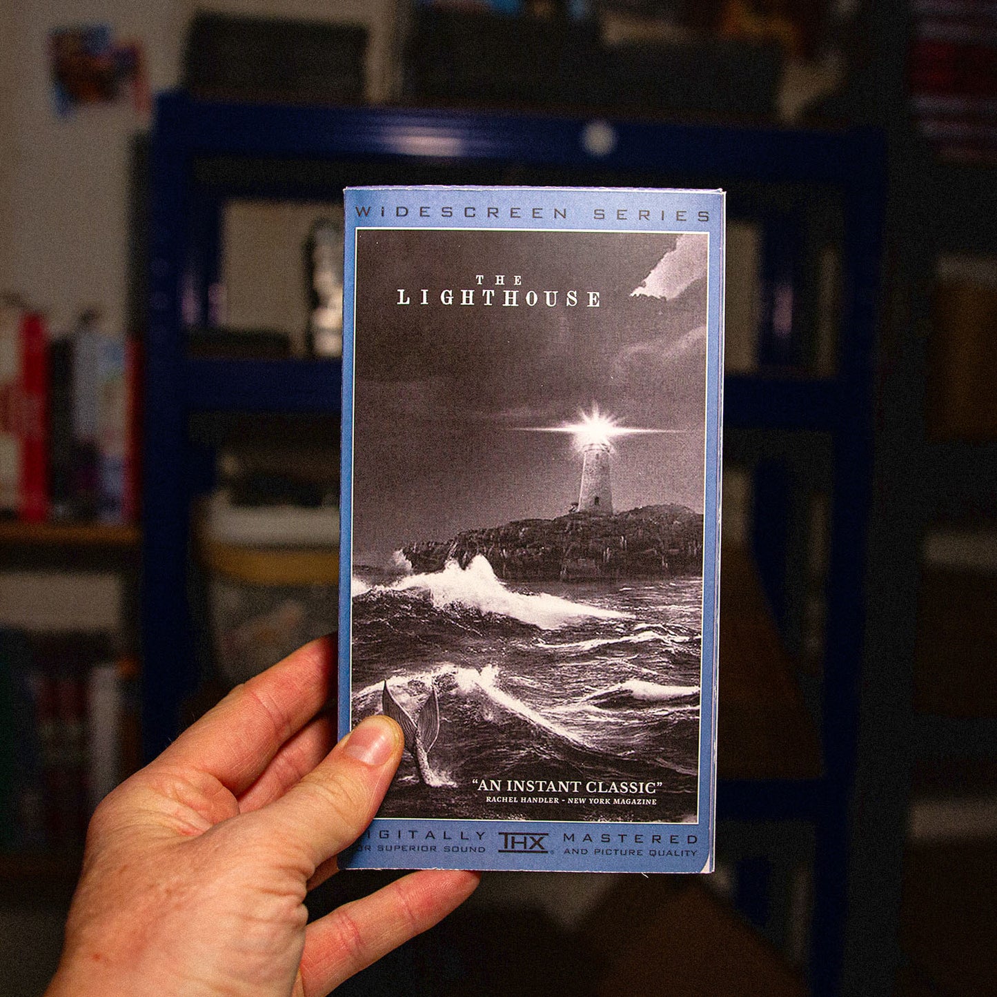 The Lighthouse on VHS — cardboard sleeve — close-up of tape label with sleeve — VCR Zone