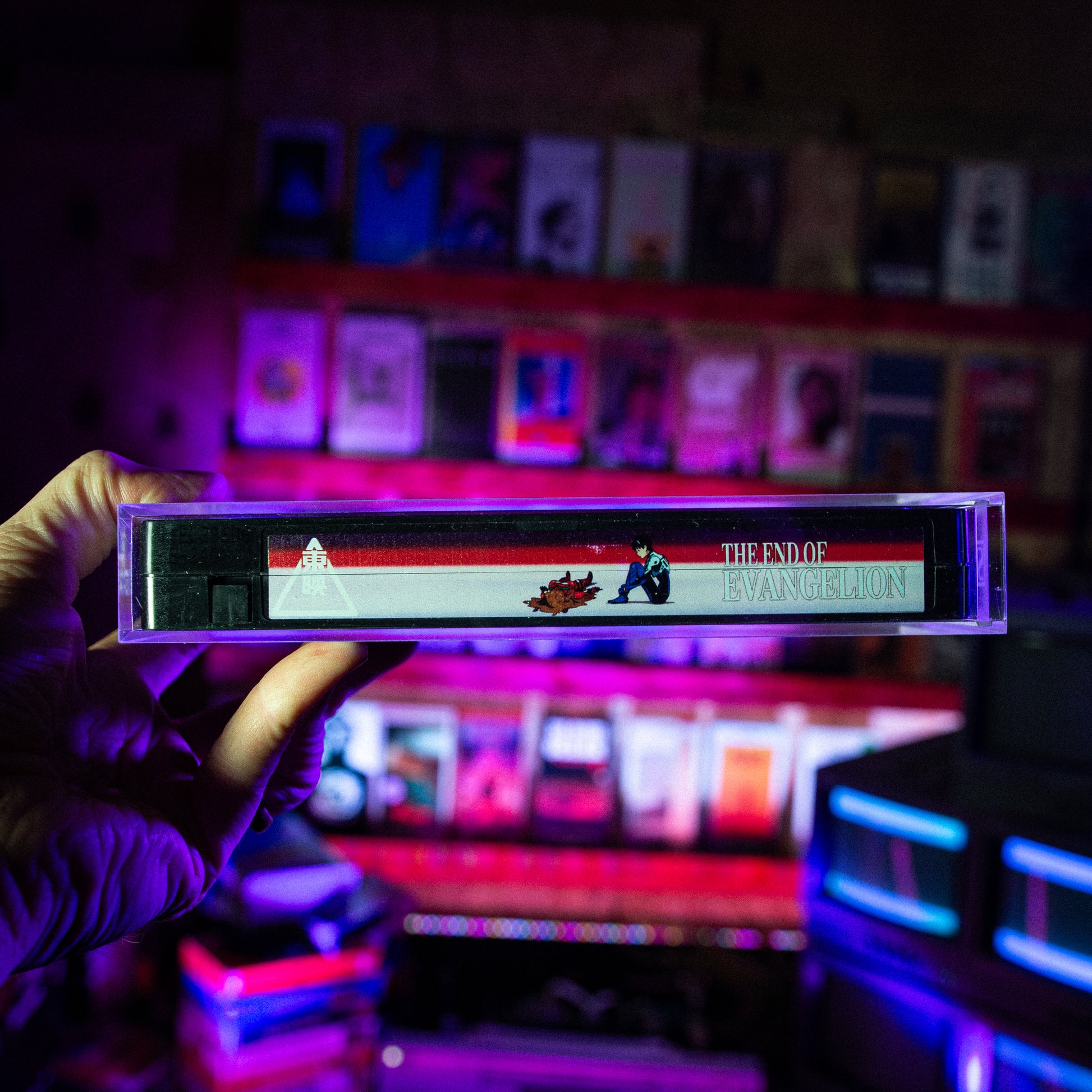 End of Evangelion VHS w/ Acrylic Case Pre-Order — cardboard sleeve — angled view showing sleeve spine title — VCR Zone
