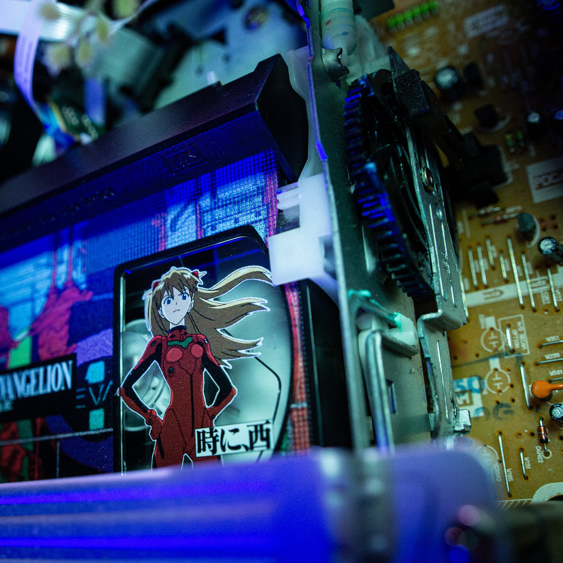 End of Evangelion VHS w/ Acrylic Case Pre-Order — cardboard sleeve — close-up of tape label with sleeve — VCR Zone