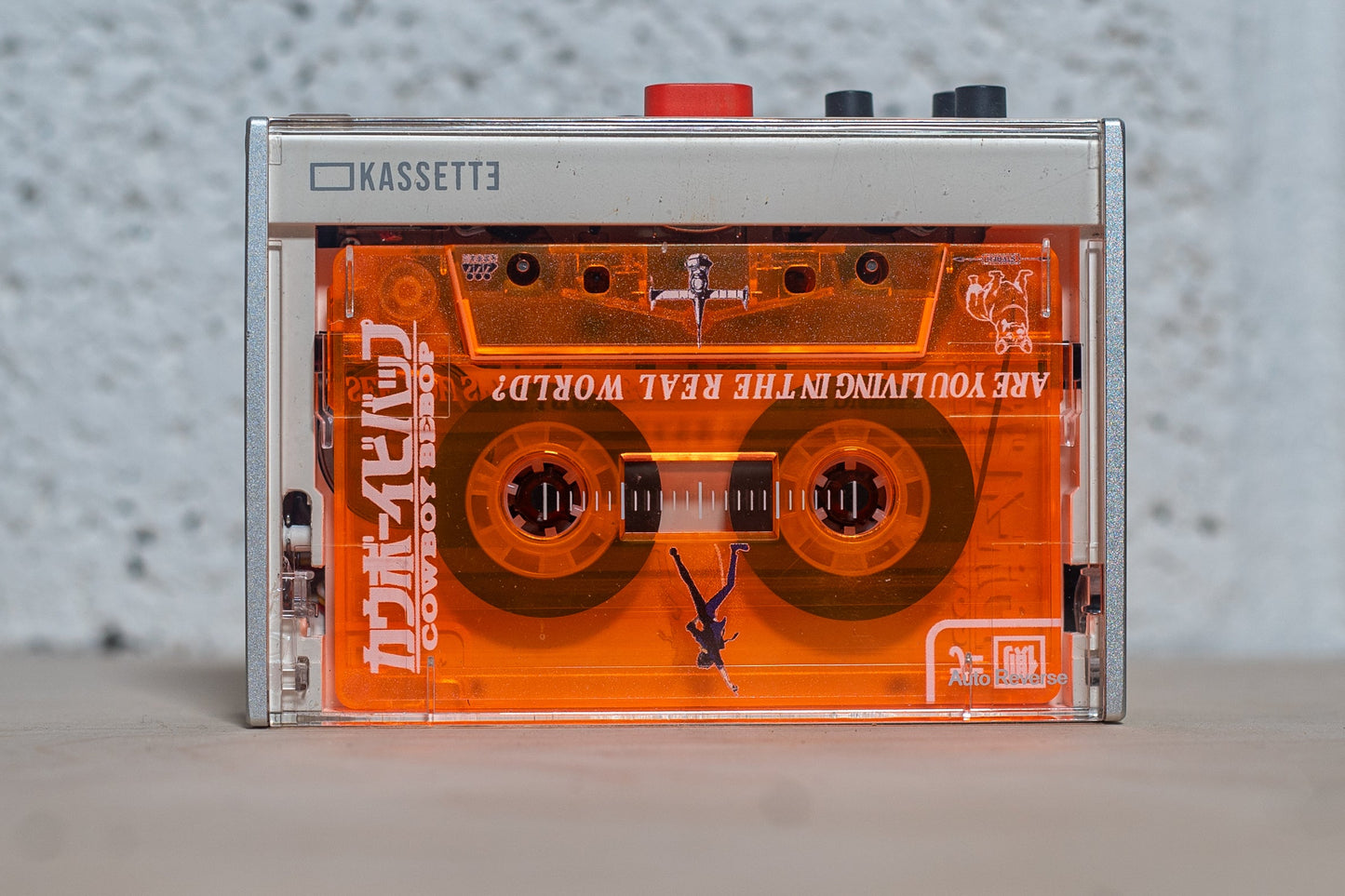 Cowboy Bebop Cassette  with cassette inside player.
