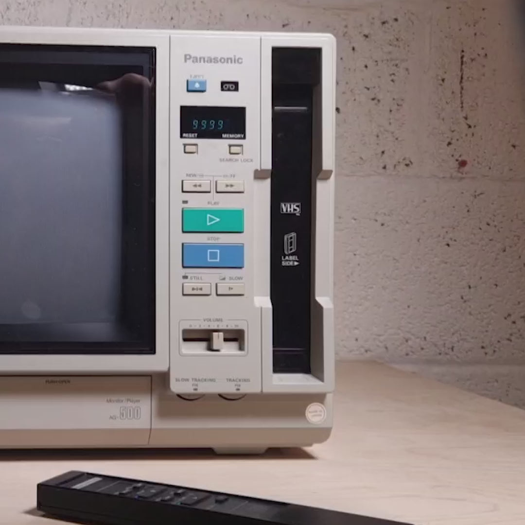 Evangelion VHS set clamshell edition played on a Panasonic ag-500 TV.